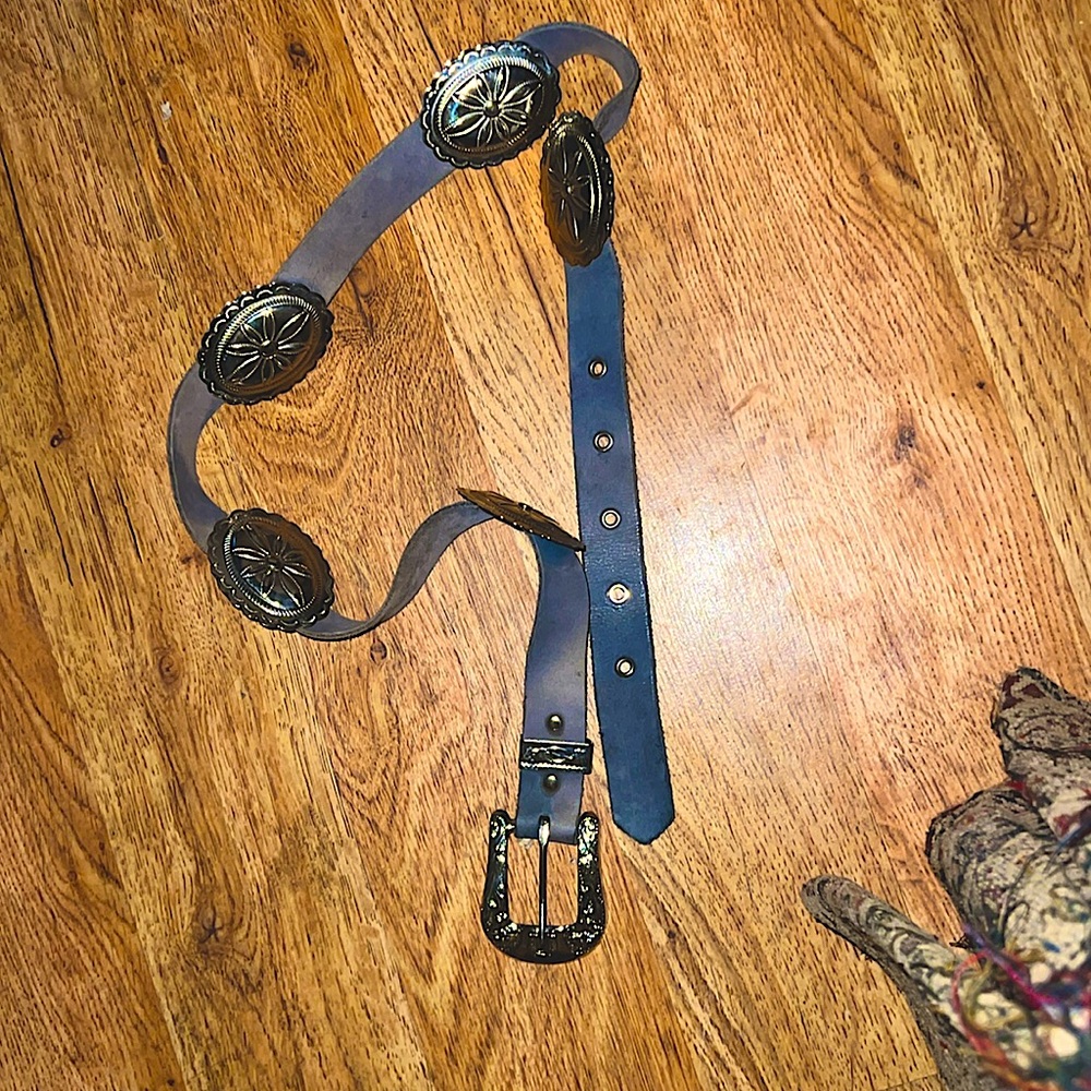 33 1/4” from last hole to belt pin. Leather belt with Light metal decorations